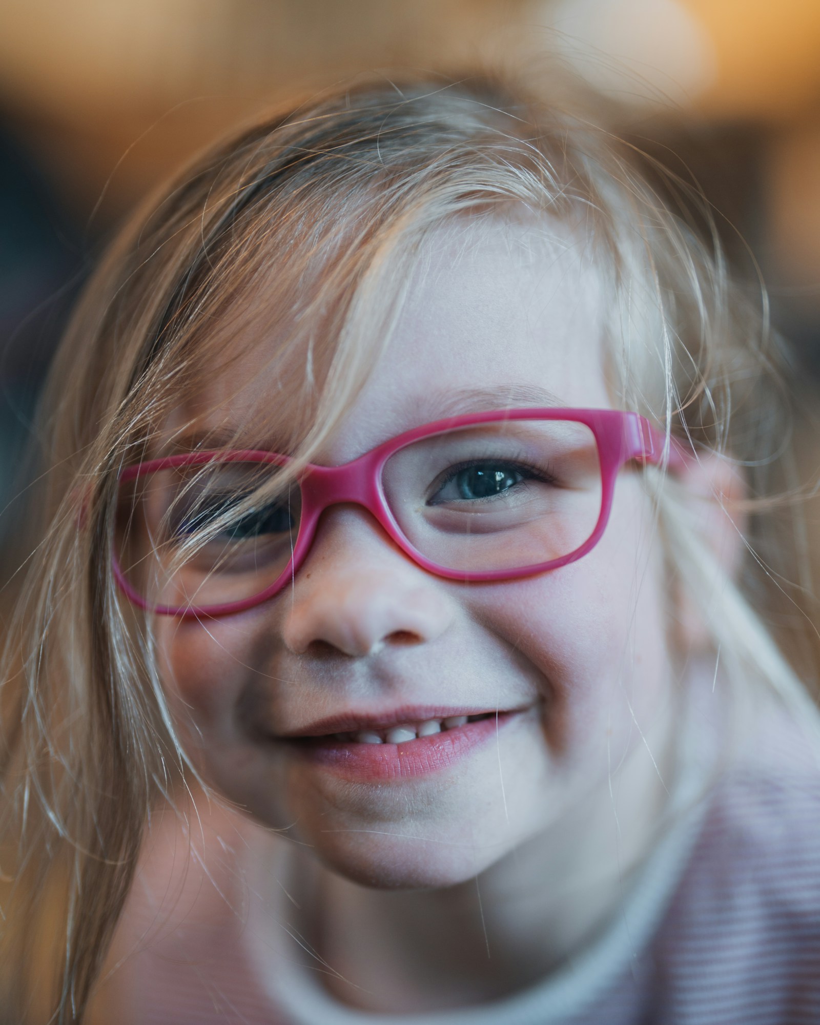 Child smiling in her new glasses